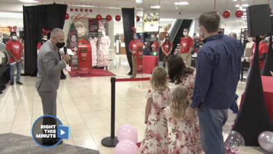 Wish kid Elizabeth in her dress with her family at a Macy's 