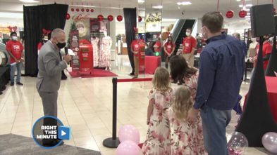 Wish kid Elizabeth in her dress with her family at a Macy's