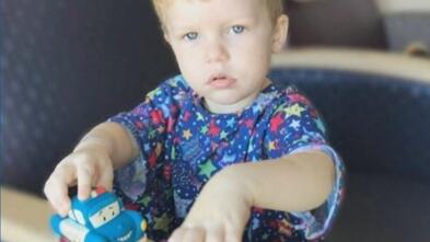Jackson plays with his toy train