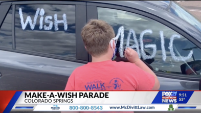 Wish magic is written on a car in the car parade