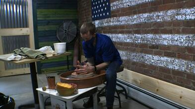 Nick works at his pottery wheel
