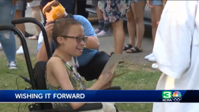 Sammie inside Land Park attending a celebration in her honor with family and friends
