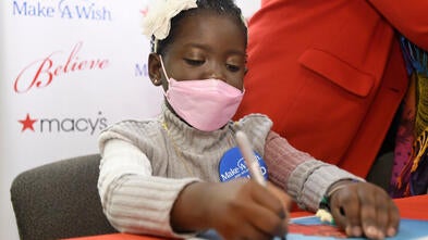 Abi signing autographs