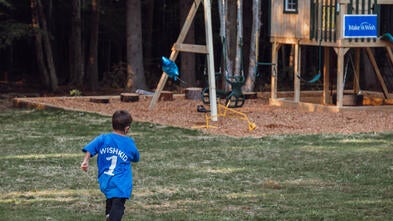 Cody runs to his playset wish