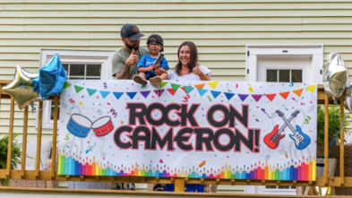 Cam receives a drum set with his parents