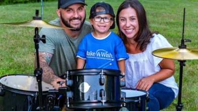 Cam receives a drum set with his parents