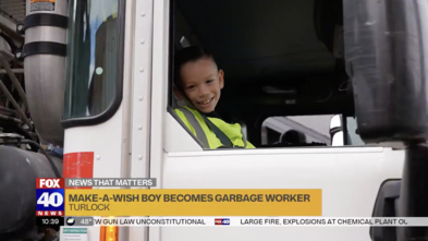 Carter in the garbage truck on his wish day