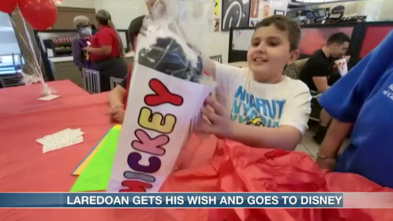 Wish kid JJ opening presents at Chick-Fil-A