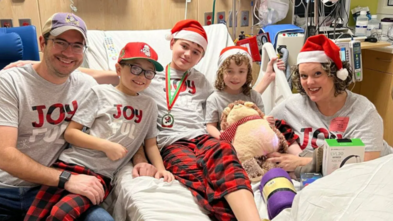 Grace and her family in her hospital room celebrating Christmas.