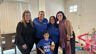 Celina celebrating her dream with representatives from Make-A-Wish OCIE and SMBMI.