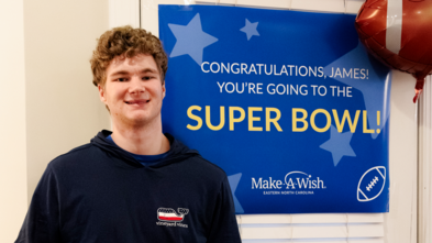 Wish kid James smiles after learning he is going to the Super Bowl. 