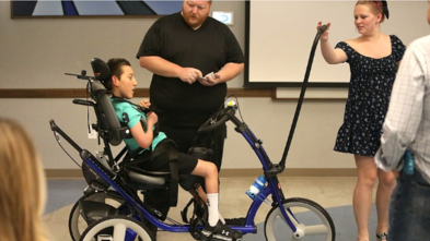 Joey with his adaptive bike