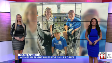 News anchors in front of a screen showing a photo of wish kid Finn. 