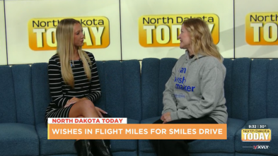 Tatum and Billi discussing the Wishes in Flight miles drive. 