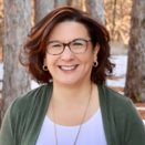 Teresa brown hair bob glasses smiling 
