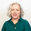 Angela smiling in a photo
