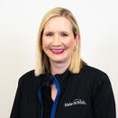 Ashley smiling in a photo