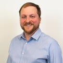 Spencer smiling in a photo
