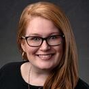 Gracie Thorpe photo with glasses and gray background