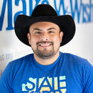 Eduardo De Los Santos, Wish Manager, in front of Wish Wall