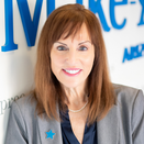 Vicki Fiorelli, Senior Director of New Business Partnerships, in front of Wish Wall