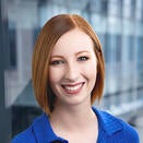 woman with red hair, blue top