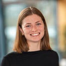 Young lady shoulder length red hair with black top