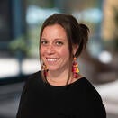 Woman with hair up, black top