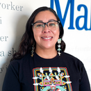 Christine Wilmont, Northern Arizona Tribal and Regional Ambassador, in front of Wish Wall
