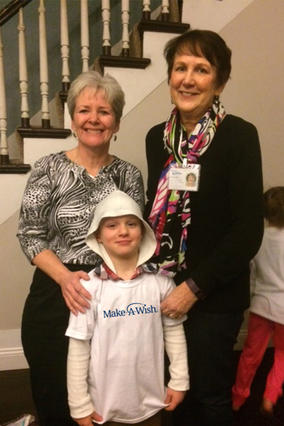 Wish kid Jared with his volunteers Jeanne and Claire. 