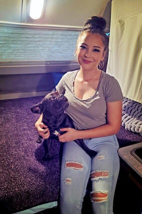 Cassie and dog on bed