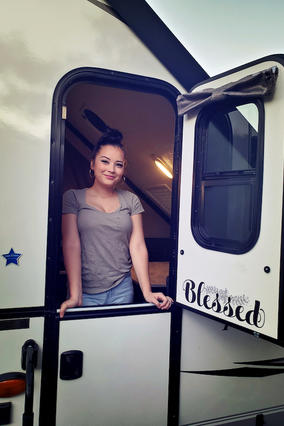 Cassie in her trailer after decorating
