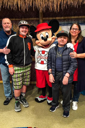 The Family pictured on Joshua's wish trip to Disneyland® Resort with Mickey Mouse