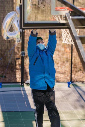 Luke shooting a basketball