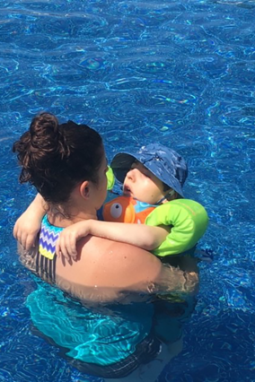 Owen and his mom swim together in his pool.