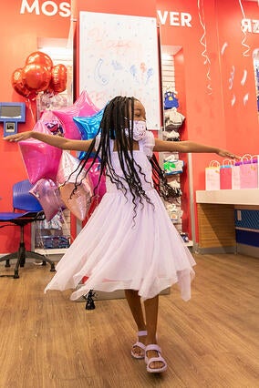 Amina twirling at birthday party