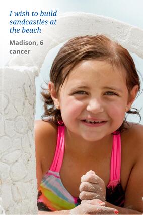 Madison at the beach in rainbow swimsuit.