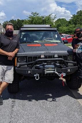 Mayson and Jon in front of Jeep