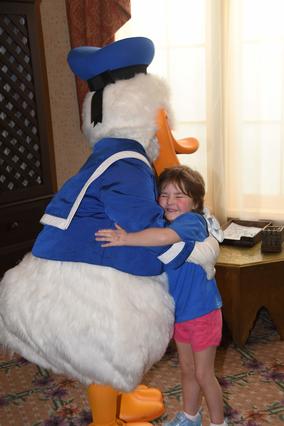Sasha hugging Donald Duck