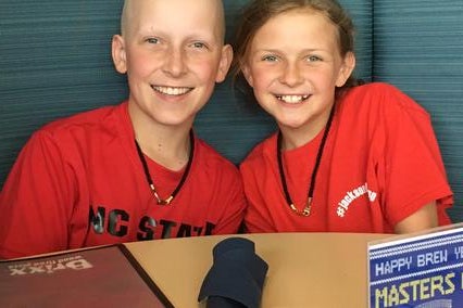 Wish kid Jackson with his sister during treatment