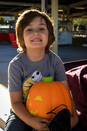 Jackson holding pumpkin