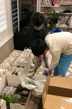 Willie and his brother Nathan prepare gift bags