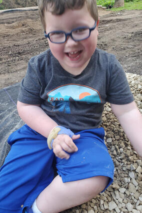 Greyson in his backyard