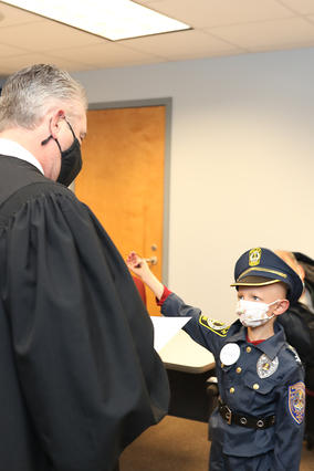 Officer Landen gets sworn in by the York Regional County Police Department.