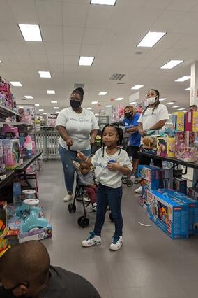 Wish kid Emoni shopping with her family