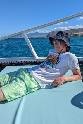 James lounging on a catamaran