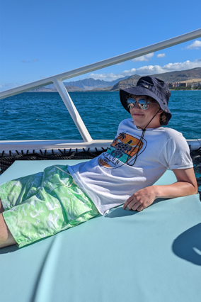 James lounging on a catamaran
