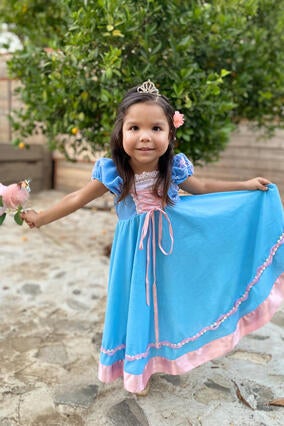 Wish kid Giselle in blue princess dress with tiara and flowers