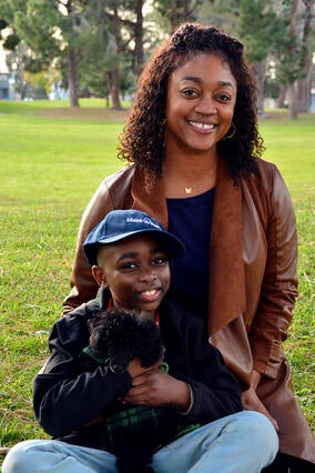 wish kid Bryce with mom and puppy, Bear, in the park