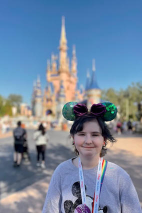 Josie on her wish in front of the Magic Kingdom Castle at Walt Disney World 
